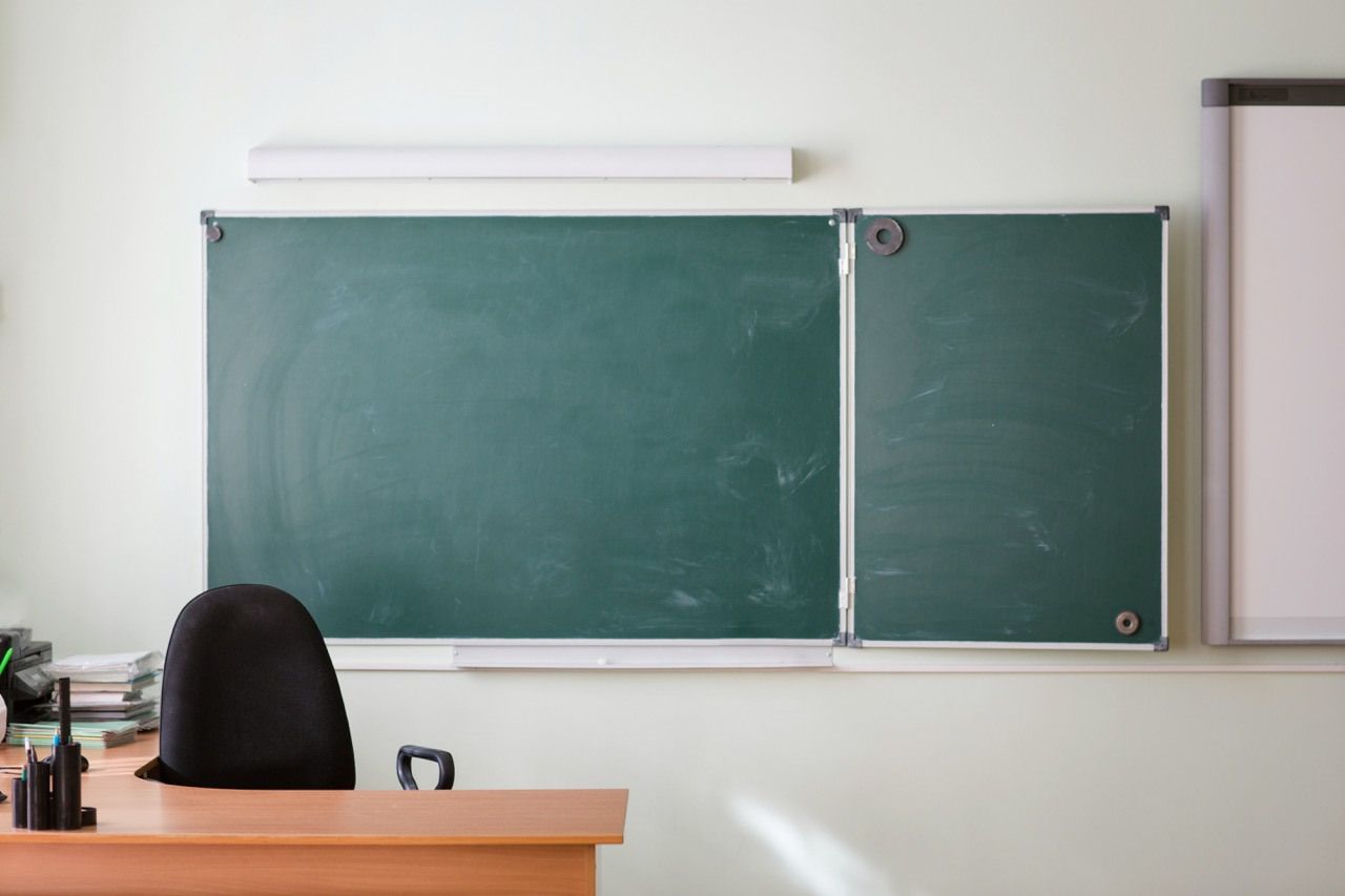 Empty teacher's desk.
